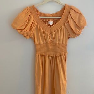A.L.C. Orange smocked maxi dress.